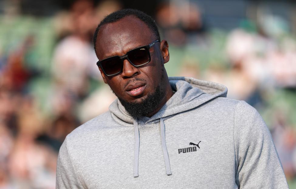 Usain Bolt in a gray hoodie and sunglasses at the Bislett Games.