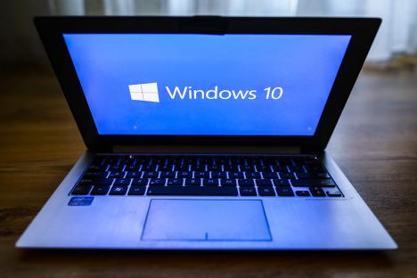 Laptop displaying the Windows 10 logo.