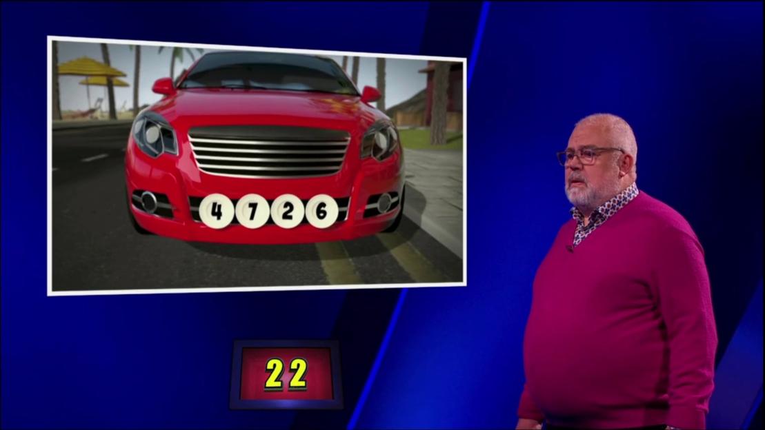 Screenshot of a game show contestant attempting to solve a number puzzle featuring a red car.