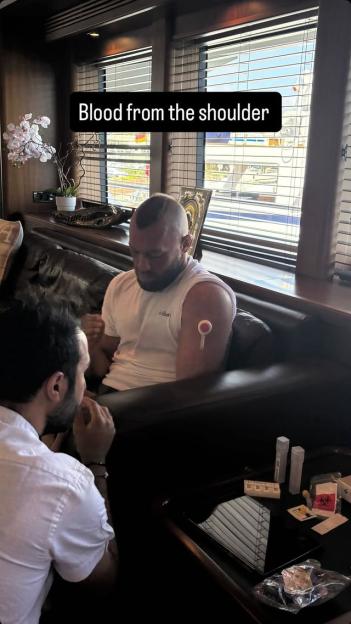 Conor McGregor having a blood sample taken from his shoulder.
