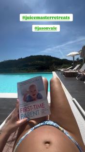 Pregnant woman by a pool reading