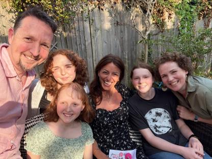 Davina McCall with a family whose daughter has a brain tumour.