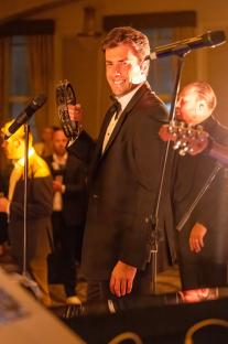 James Argent performing at a charity event.