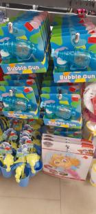 Bubble guns and other toys on display at a store.
