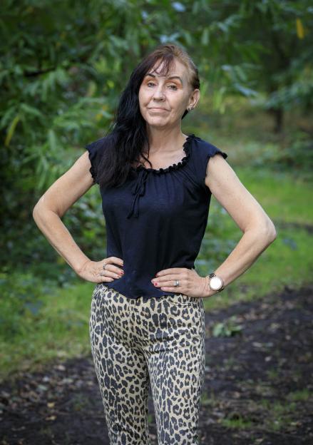 Sandra McKenzie, a former pop star, standing outdoors.