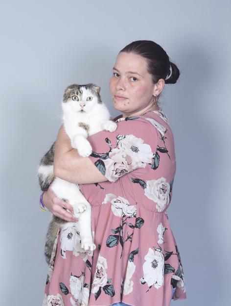 Woman holding a cat.