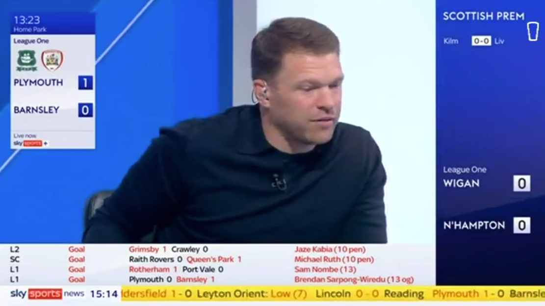 Man on sports program discussing game results.