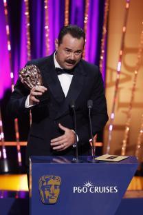 Danny Dyer accepting a BAFTA award.