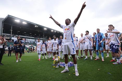 Junior Firpo of Leeds United celebrates winning The Championship title.