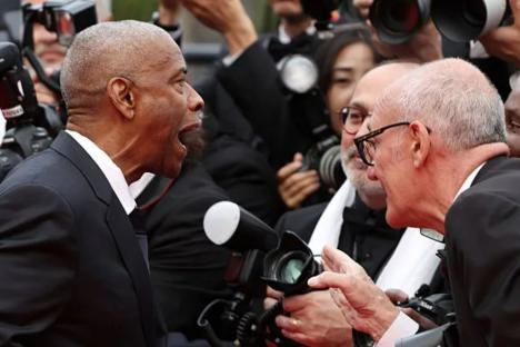 Watch shock moment Denzel Washington hits out at Cannes photographer in explosive red carpet clash