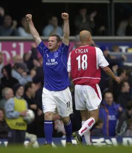 Wayne Rooney celebrating after scoring a goal.