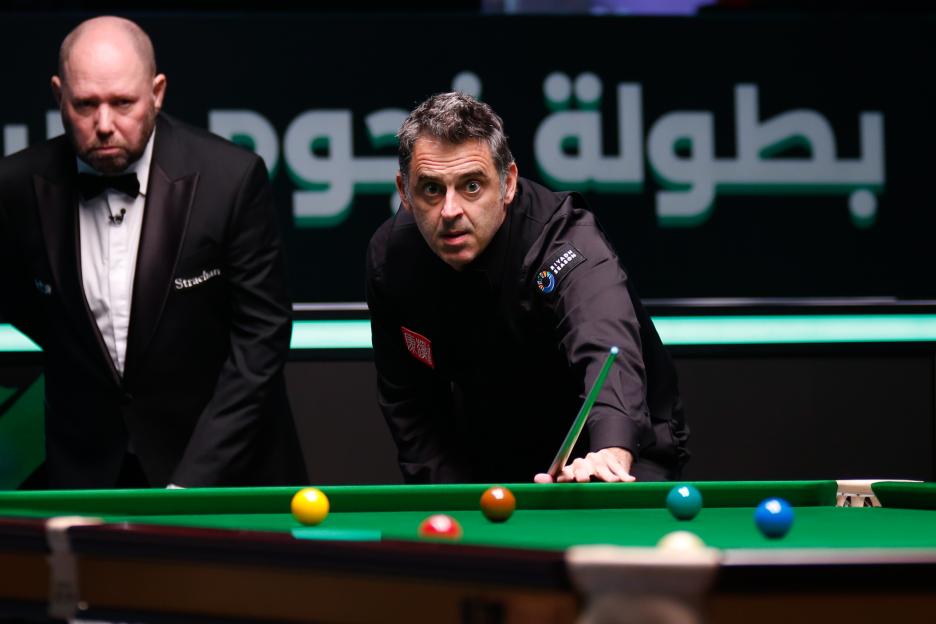 Ronnie O'Sullivan playing snooker.