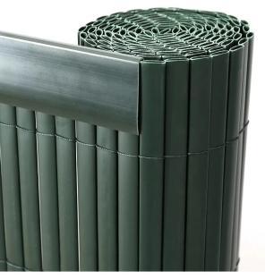 Rolled-up dark green plastic fence privacy screen.