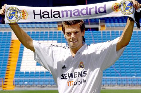 Jonathan Woodgate, new Real Madrid player, holding a team scarf.