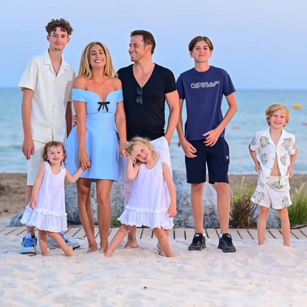Stacey Solomon and her family on a beach.