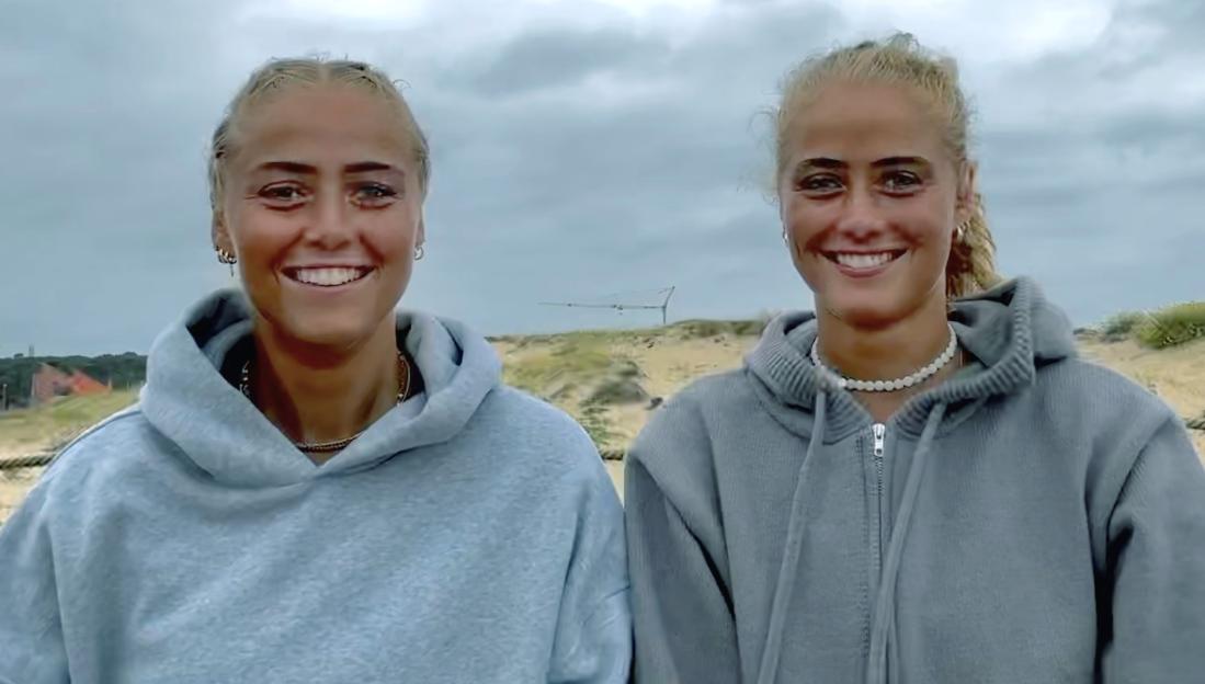 Identical twin sisters, Marie and Marie, smiling for a photo.
