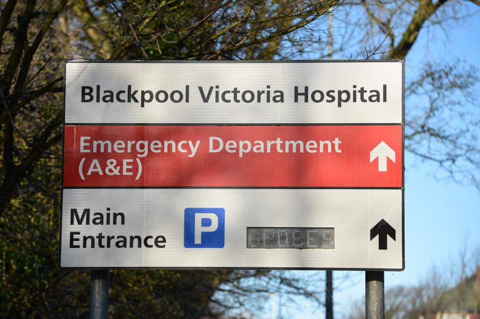Blackpool Victoria Hospital sign: directions to Emergency Department (A&E) and Main Entrance with parking.