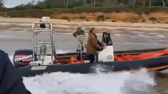 Moment drug-smuggling pals DIVE into water during boat chase as they attempt to flee Border Force with cocaine in hull