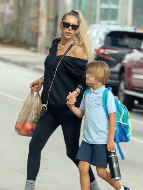 Rarely-seen tennis legend Anna Kournikova, 44, shows off growing baby bump months after health scare