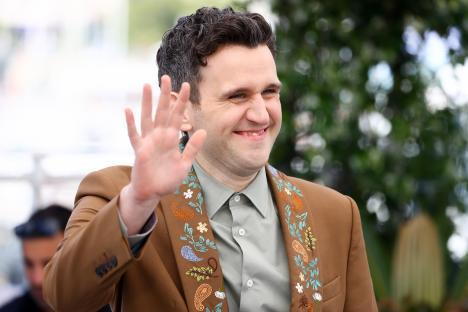 Harry Melling waving at the Cannes Film Festival.
