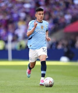Claudio Echeverri of Manchester City playing soccer.