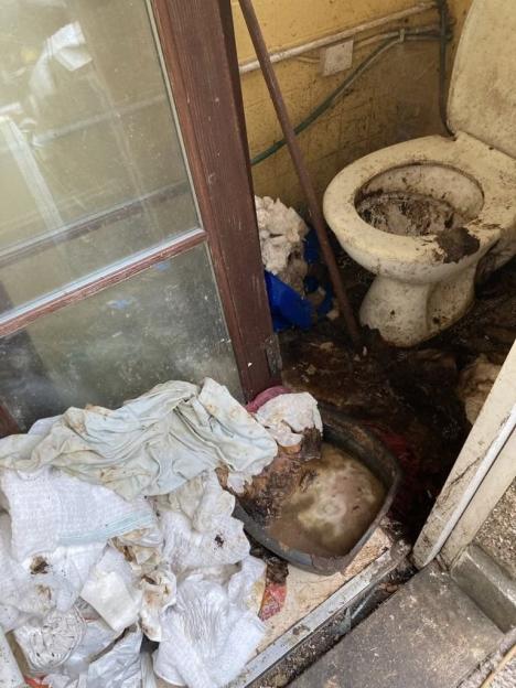 A toilet showing waste left behind by tenants.