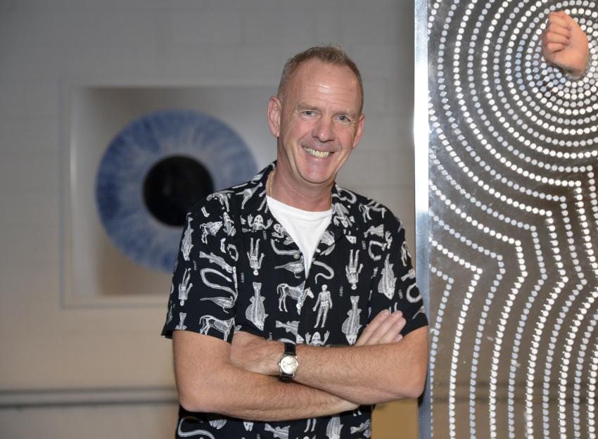 Electronic musician Fatboy Slim poses at the CXLA exhibition.