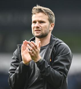 Watford manager Tom Cleverley applauding fans.