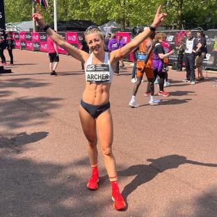 Runner Holly Archer celebrating a race victory.