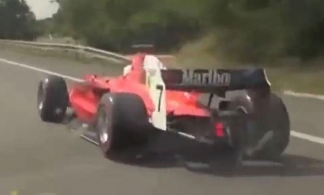 Formula 1 car driving on a motorway.