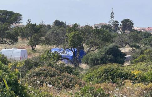 Portuguese police closing dirt roads near Praia da Luz, preparing for a search.