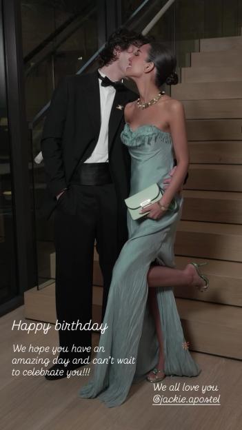 Jackie Apostel being kissed by a man in a tuxedo, celebrating her birthday.