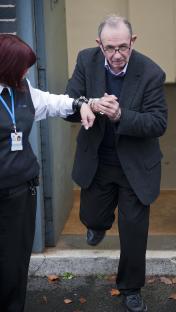 John Allen, a child abuser, in handcuffs at court.