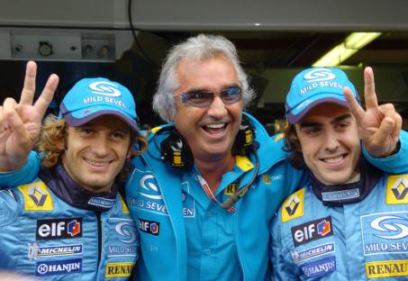 Jarno Trulli, Flavio Briatore, and Fernando Alonso celebrating a qualifying session.