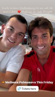 Photo of two men smiling for a selfie.