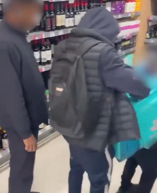 Shock moment shoplifters load bag with bottles of booze at Waitrose as hapless ‘security guard’ stands next to them