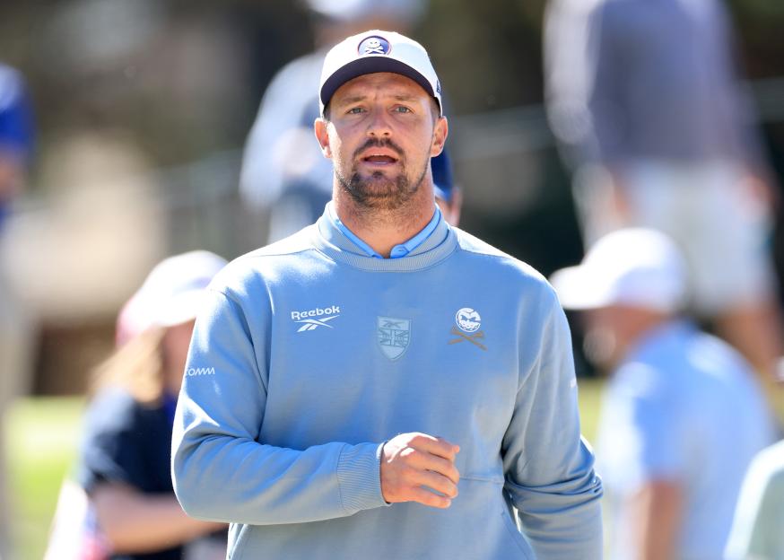 Bryson DeChambeau watching matches in the gallery at the 2025 Walker Cup.