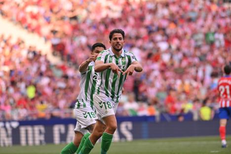 Soccer players celebrating a goal.