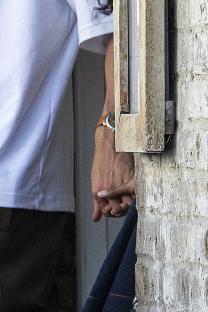 Maya Jama and Ruben Dias holding hands.