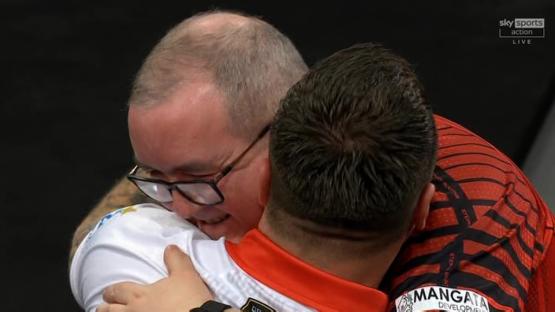 Two men embracing.