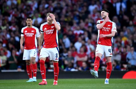Arsenal players reacting after a goal.