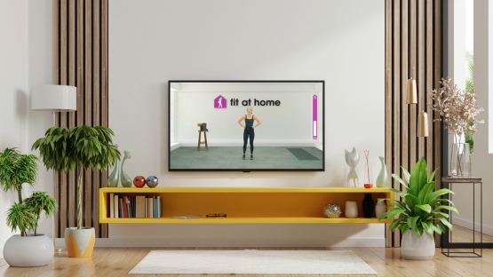 Television screen showing a woman doing a home workout.