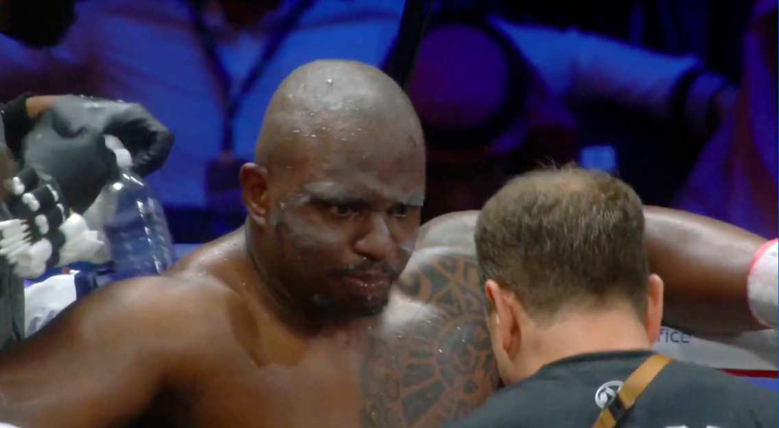 Boxer having his face cleaned between rounds.