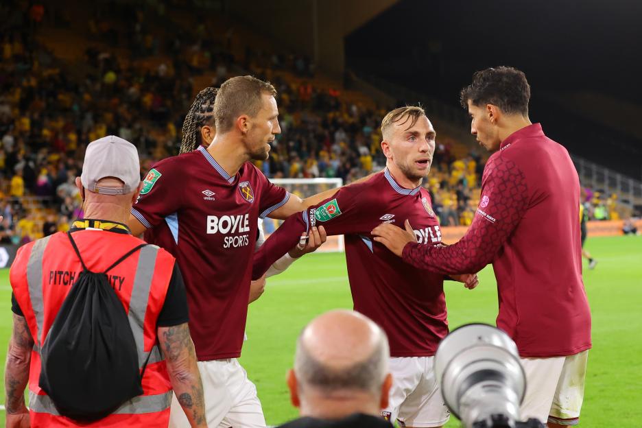 Jarrod Bowen of West Ham United being helped by teammates.