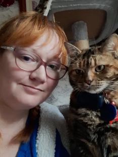 A woman and her tabby cat.