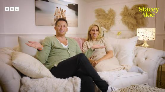 Stacey Solomon and Joe Swash on a sofa, discussing their new BBC series.