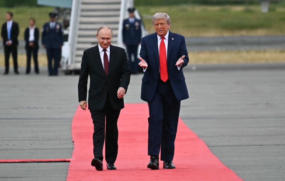 Presidents Putin and Trump walking on a red carpet.