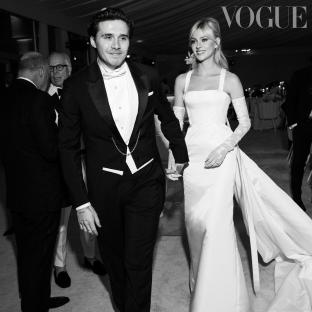 Black and white photo of Nicola Peltz and Brooklyn Beckham at their wedding.