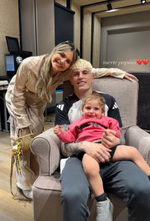 Family photo; a man, woman, and toddler.