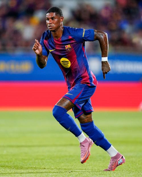 Marcus Rashford of FC Barcelona running on the field.